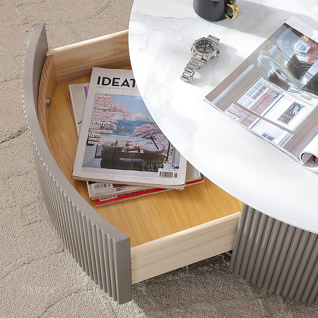 Modern Coffee Table With Drawer Open, Revealing Storage. White Sintered Stone Top and Gray Fluted Side, Ideat Magazine.