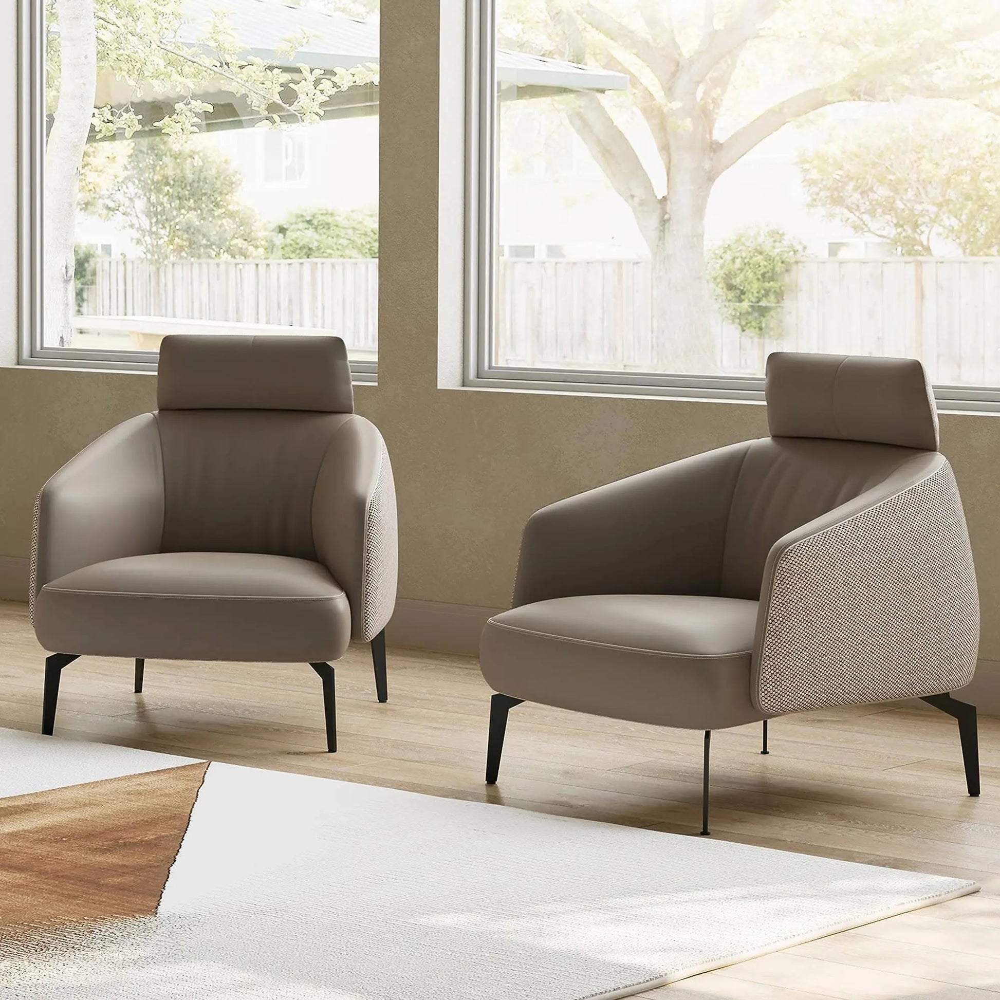 Taupe Napa Leather Lounge Chair, Modern Ergonomic Design With Fabric Detail and Black Legs, Perfect for Living Room.