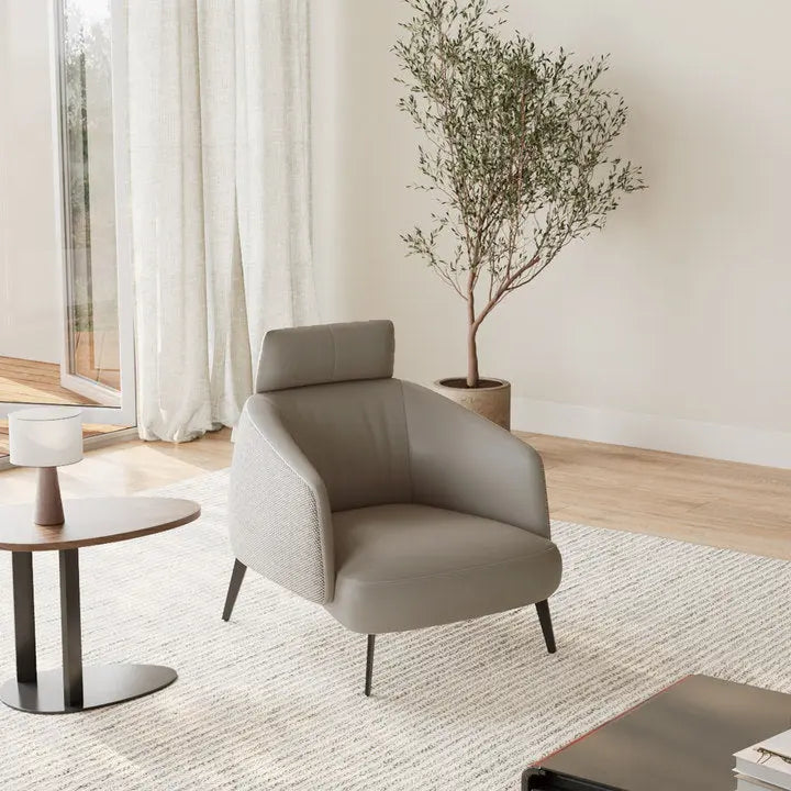 Taupe Napa Leather Lounge Chair in Modern Living Room. Ergonomic Design, Textured Fabric Detail.