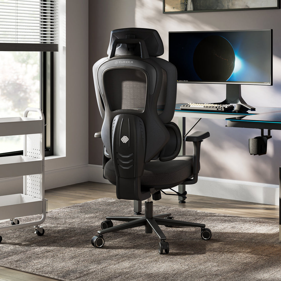 Typhon II Hybrid Ergonomic Gaming Chair - Typhon II Hybrid Ergonomic Gaming Chair in a modern office setting with a computer desk and monitor, black