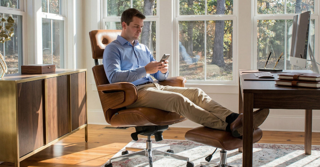 Man sitting in an ergonomic office chair in a home office, representing HSA/FSA-eligible furniture options