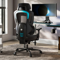 A black and blue gaming chair in a room with a computer setup blue
