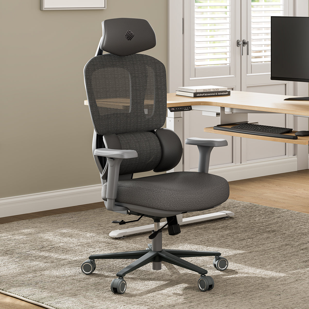 Gray office chair in a home office setting with a desk and computer monitor.