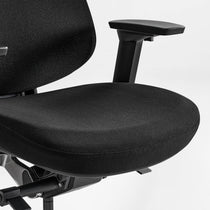 Eureka Ergonomic Lira black ergonomic office chair close-up: textured fabric seat, armrest, and adjustment levers visible.