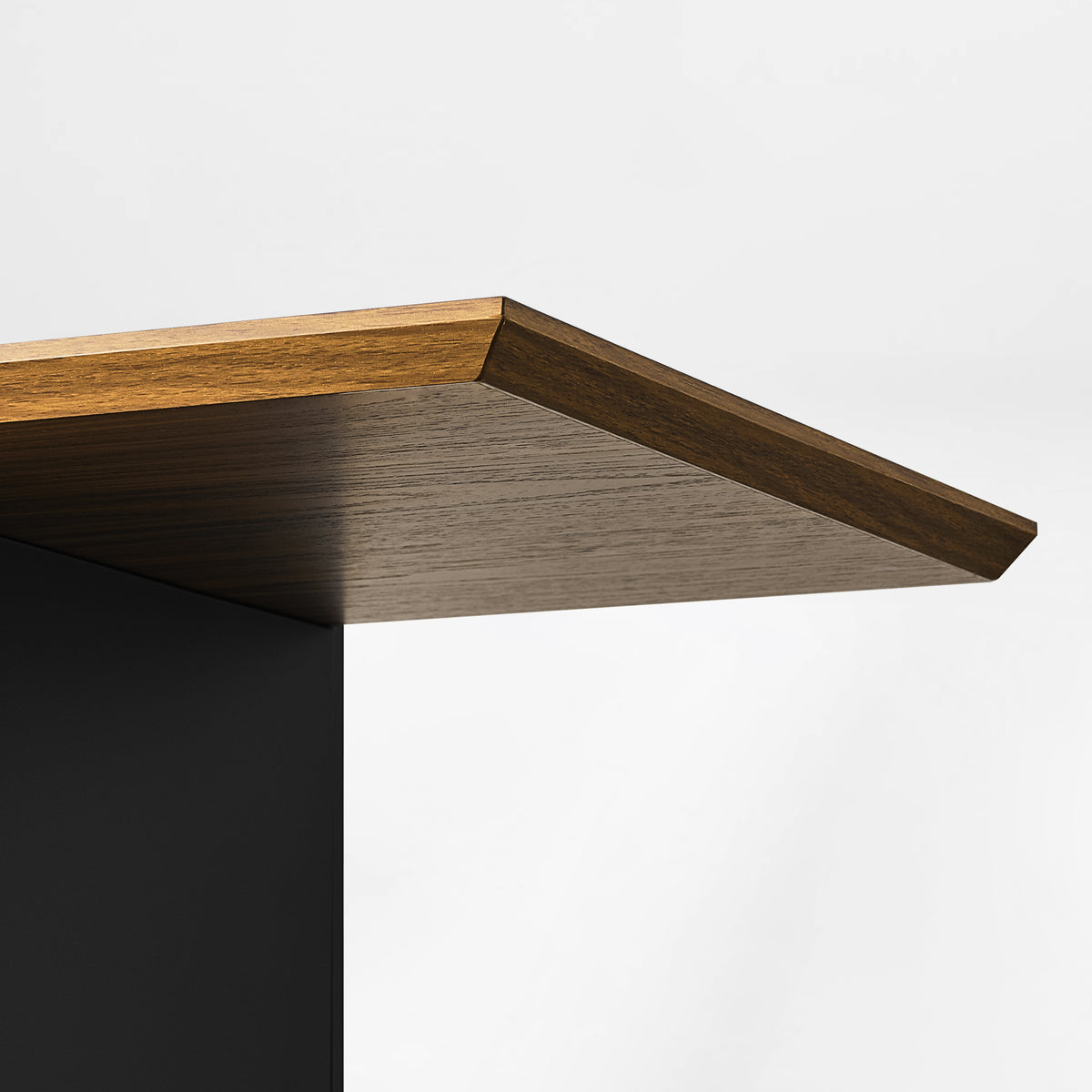 Eureka Ergonomic Ark 78 inch walnut bookshelf with a close-up of the beveled display shelf edge