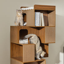 Eureka Ergonomic Pawlio 72" walnut bookshelf cat tree with fluted panels, plush beds, and two cats.