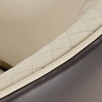 Anareli Dining Chair Detail: Beige Diamond-Stitched Faux Leather Backrest With Silver Stitching and Dark Brown Trim.