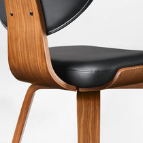 Eureka Ergonomic Belmar black leather dining chair close-up: bentwood frame, leather seat. Material and design detail.