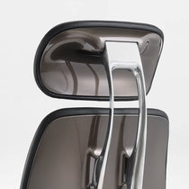 Eureka Ergonomic Forma ergonomic chair headrest detail: dark gray molded plastic, stitched PU leather, chrome frame.
