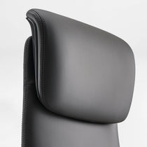 Eureka Ergonomic Serene Aaron black genuine leather executive chair headrest close-up, showing stitching and smooth texture detail.