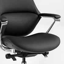Eureka Ergonomic Nox black genuine leather executive chair with wave stitching detail and polished chrome armrests.