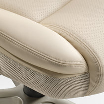 Eureka Ergonomic Close-up of a cream faux leather office chair with perforated upholstery, contrasting stitching, and breathable mesh accents.