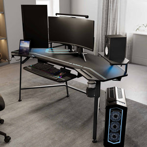 Eureka Ergonomic Wing shaped gaming desk setup with dual monitors, keyboard tray, PC, speakers, and RGB lighting.
