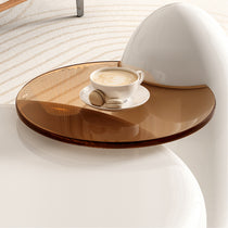 Modern Coffee Table Set With Amber Glass Tray, White Cup With Coffee and Macaroons.