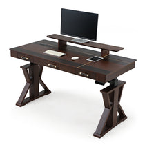 Ark Sws Pro Executive Standing Desk in Dark Brown Wood Finish With Monitor, Keyboard, and X-Shaped Legs.