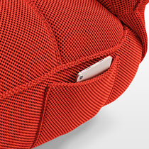 Red Techno 3D Fabric Detail On Linx Power Glider Recliner, Showcasing a Phone Pocket for Modern Convenience.
