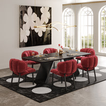 Rlesana Velvet Dining Chairs in Red Around a Black Dining Table, Showcasing Petal Back Detail.