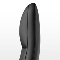 Eureka Ergonomic Nox black genuine leather executive chair headrest close-up showing textured grain and stitching detail.