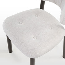 Nibbles Dining Chair in White With Geometric Fabric Pattern and Dark Legs.