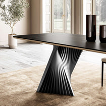 Eureka Ergonomic Oasis 105.5" black sintered stone dining table with twisted black metal pedestal base in an elegant dining room.