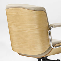 Eureka Ergonomic close-up of the beige Mathias Mason chair's curved oak wood back shell