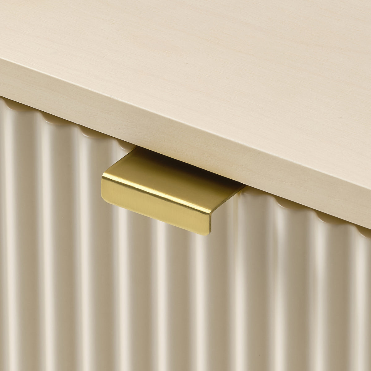 Eureka Ergonomic Opal file cabinet brass pull detail, close-up of the tab handle on the fluted drawer front