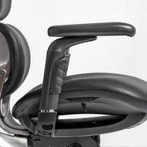 Eureka Ergonomic Black Forma ergonomic chair seat cushion and padded armrest detail with PU leather and stitching.