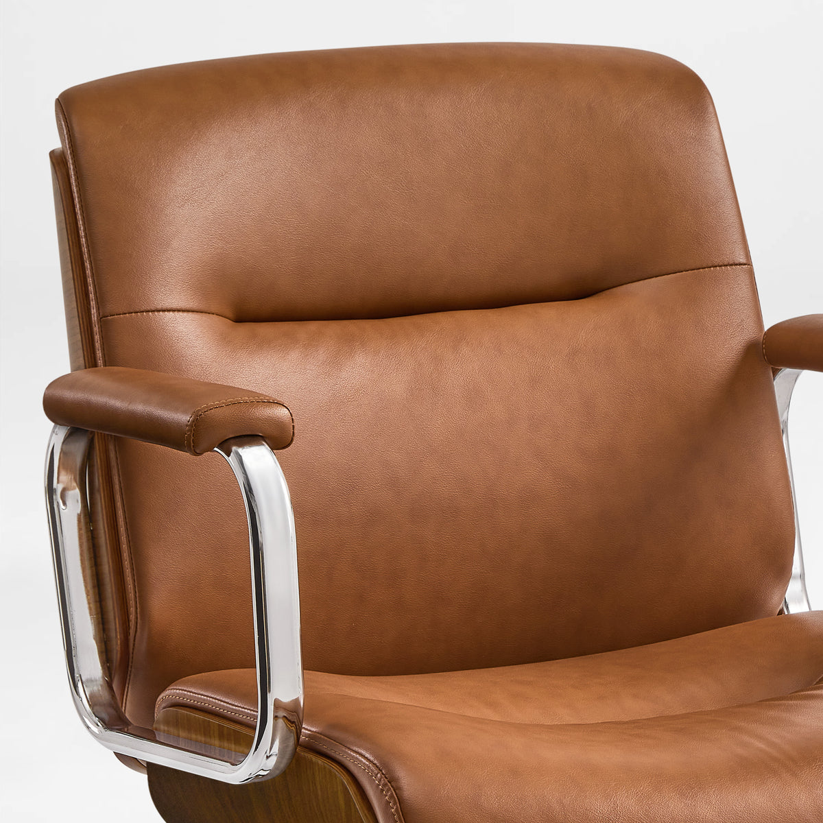 Eureka Ergonomic front close-up of the brown Mathias Mason chair's padded backrest and metal armrests