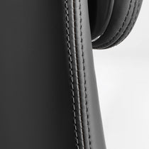 Eureka Ergonomic Serene Aaron black leather executive chair close-up: smooth texture and stitching detail.