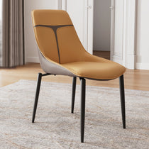 Couture Dining Chair in Turmeric Leather With Gray Accents and Black Legs.