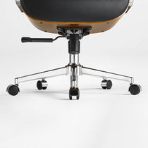 Eureka Ergonomic close-up of the black Mathias Mason chair's chrome base, gas lift, and caster wheels
