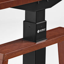 Eureka Ergonomic Close-up of dark woodgrain standing desk surface with black metal legs.