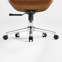 Eureka Ergonomic close-up of the brown Mathias Mason chair's chrome base, gas lift, and caster wheels