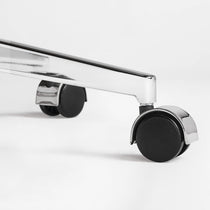 Eureka Ergonomic close-up of a caster wheel and polished metal base on the beige Mathias Mason chair