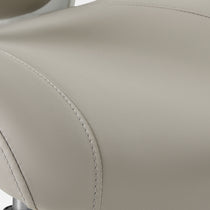 Eureka Ergonomic Close-up of light grey PU leather seat on Vera ergonomic office chair, showing texture and white stitching detail.