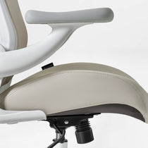 Eureka Ergonomic Vera ergonomic office chair close-up of light grey PU leather seat with white frame and armrest detail.