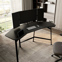 Black Aero Wing-Shaped Studio Desk With Triple Monitors, Keyboard, and Mouse.