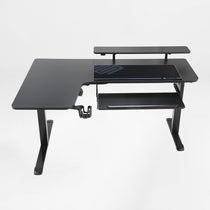 Eureka Ergonomic Black L-shaped standing desk with pull-out keyboard tray, monitor riser, cup holder, and double headphone hook.