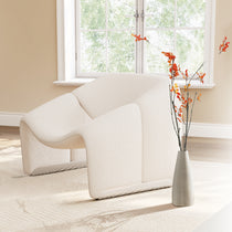 Cozy Living Room Decor Featuring ALD-01 Fall Ficus Branches, White Bouclé Chair, and a Stylish Vase.