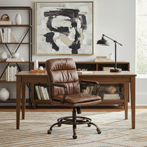 Eureka Ergonomic Regal PU leather executive chair with tufted cushioning in a home office setting.