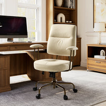 Eureka Ergonomic Becky cream faux suede office chair with bronze legs in a home office, next to a wooden desk and bookshelf.