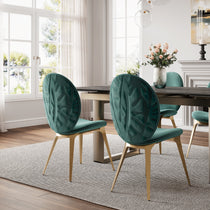Emerald Green Katalea Velvet Dining Chairs With Gold Legs and Embossed Leaf Pattern, in a Contemporary Dining Room.