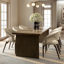 Chantilly Leather Dining Chairs in a Modern Dining Room Setting With Wooden Table and Gold Accents.