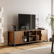 Sonoma 70 Tv Stand in Living Room With Wood Grain Finish, Black Steel Frame, and a Tv.