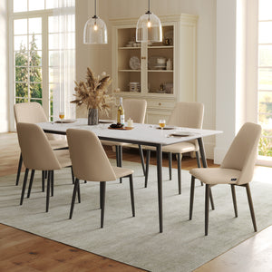 Off-White Upholstered Dining Chairs Around a Modern Dining Table in a Bright Dining Room.