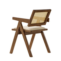 Eureka Ergonomic Mila walnut dining chair with woven rattan back and cream seat cushion, mid-century modern design with splayed legs.