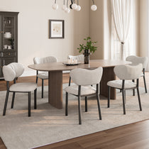 Nibbles Dining Chairs Set in a Modern Dining Room Setting, Featuring White Geometric Patterned Fabric and Dark Legs.