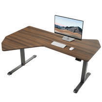Eureka Ergonomic Blossom Dynamics dark wood grain L-shaped standing desk with monitor, keyboard, and mouse for home office setup.