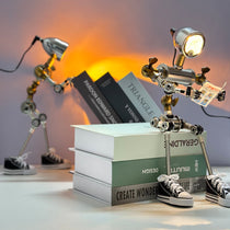 Robot-Shaped Cyberpunk Table Lamp With Industrial Design, Holding a Paper, Beside Books With Create Wonder Texts.