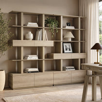 Eureka Ergonomic Ark 78 inch oak bookshelf with drawers and display shelves in a home office